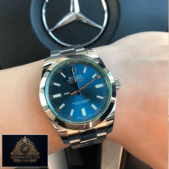 Rolex Milgauss 116400GV Green Crystal Oyster Replica on his arm and Mercedes logo on the back