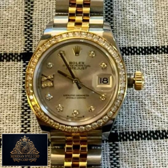 Rolex Datejust 279383RBR-0003 Champagne & Diamond Dial Jubilee Replica on the table