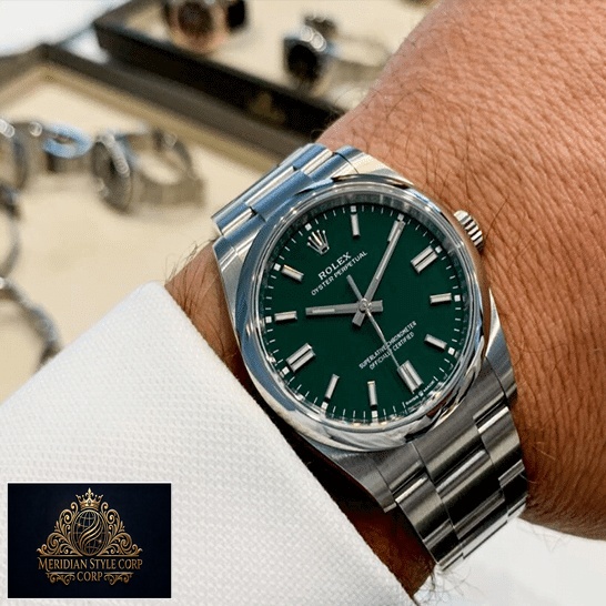 Rolex Oyster Perpetual Green Dial 126000 Replica on his arm