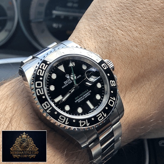 the guy's wearing a Rolex Gmt Master 11610LN-0001 Replica.