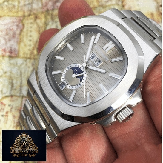 Patek Philippe Natilus Grey Dial Moon Steel Replica on the hand map background