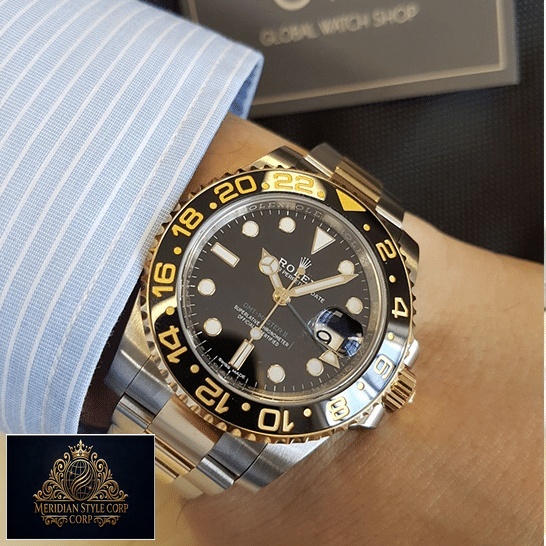 under the shirt Rolex GMT-Master II 116713 Two Tone Oyster Replica on his arm
