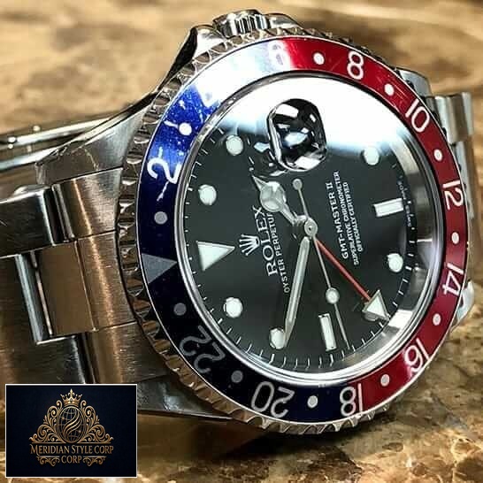 Rolex GMT-Master II 16710 "Pepsi" Premium Duplicate rolex 16710 replica3S Rolex Submariner GMT-Master II Red & Blue Bezel 16710 Oyster Replica on the Table