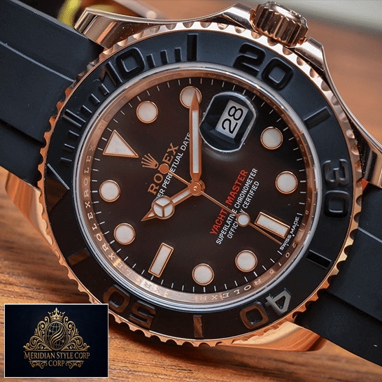 Rolex Yacht Master Black Dial Replica on the table