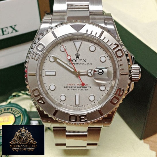 Rolex Yacht Master Platinum Dial Steel Replica next to warranty card
