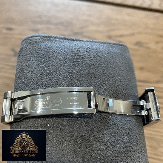 Rolex Datejust 126200-0008 with gray stand open clap