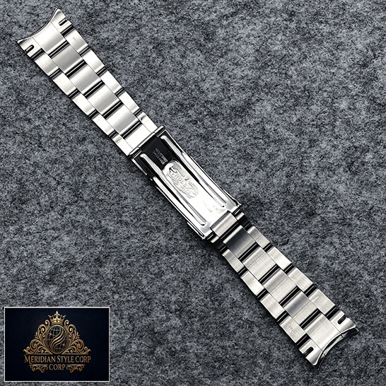 Rolex Datejust Perpetual 114300 Replica Stainless Steel Fold Clasp Bracelet on the table