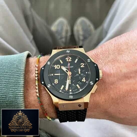 Hublot Big Bang Black Bezel Gold Case Replica on the man wrist
