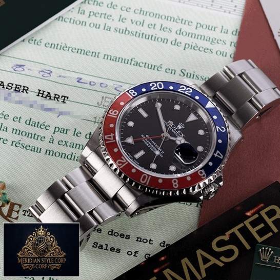 Rolex GMT-Master Pepsi 116719BLRO-0001 Replica on the table