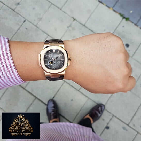 Patek Philippe Rose Gold Case Black Dial Leather Bracelet Replica on the man wrist
