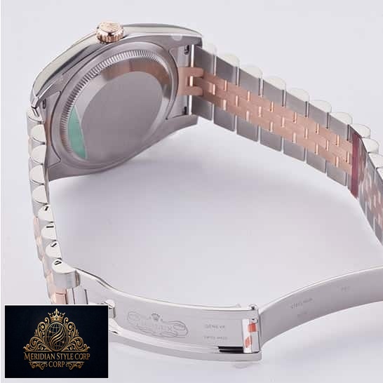 Rolex Datejust 36 116231 Two Tone Jubilee Bracelet Replica Open Fold Clasp on the table