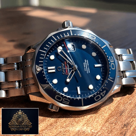 Omega Seamaster 300m Axial Steel Replica on the wooden table