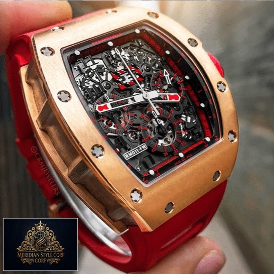 Richard Mille Black Dial Gold Bezel Replica on the fingers