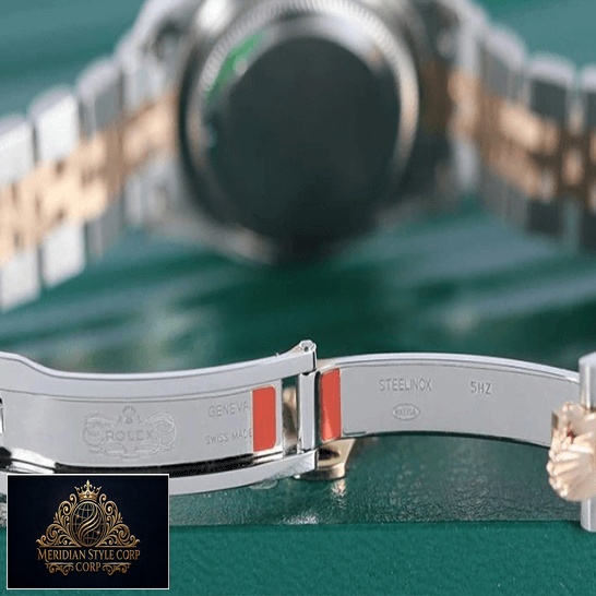 Rolex 279161 Everose Gold Jubilee Replica opened clasp on the green table