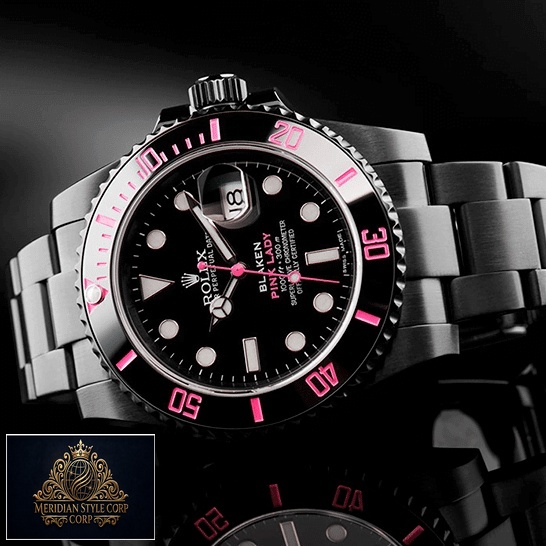Rolex Blaken Submariner Pink Bezel and Black Dial on the table